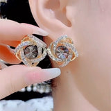Gray zircon winding earrings, feminine temperament, light luxury, high-end silver needle earrings, popular Popular style ear jewelry in