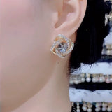 Gray zircon winding earrings, feminine temperament, light luxury, high-end silver needle earrings, popular Popular style ear jewelry in